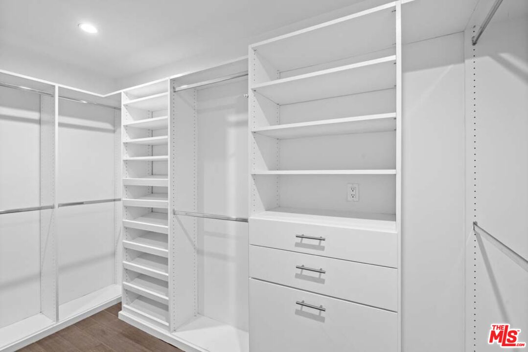 10453 Holman Avenue Los Angeles, CA 90024 - Photo 44 of 67 a view of walk in closet with empty racks