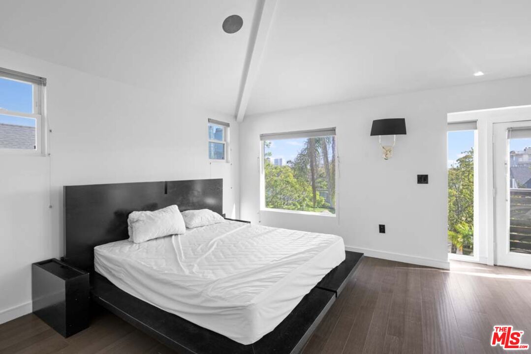 10453 Holman Avenue Los Angeles, CA 90024 - Photo 48 of 67 a bedroom with a bed and window