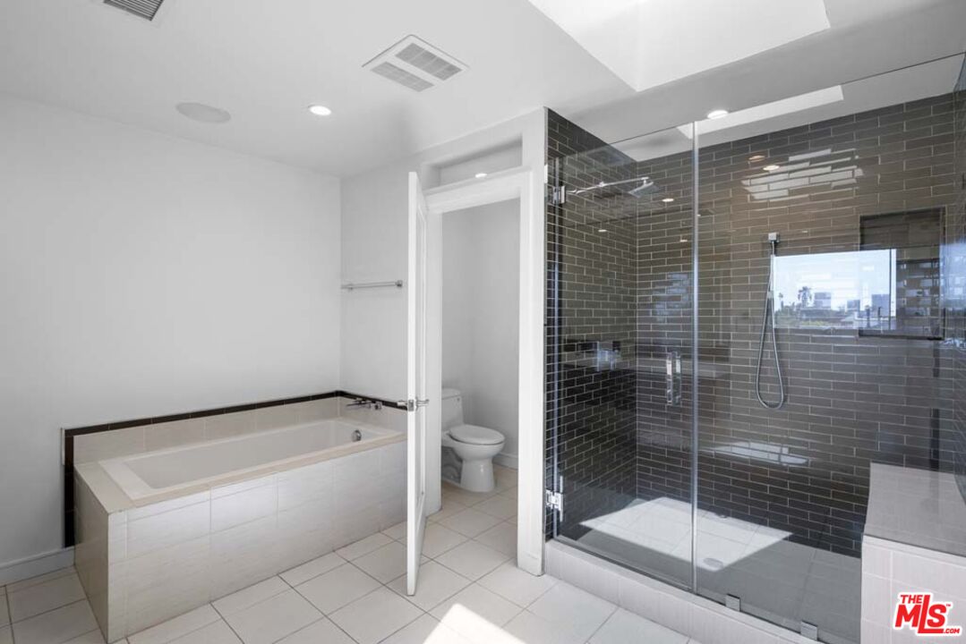 10453 Holman Avenue Los Angeles, CA 90024 - Photo 54 of 67 a bathroom with a shower and a sink