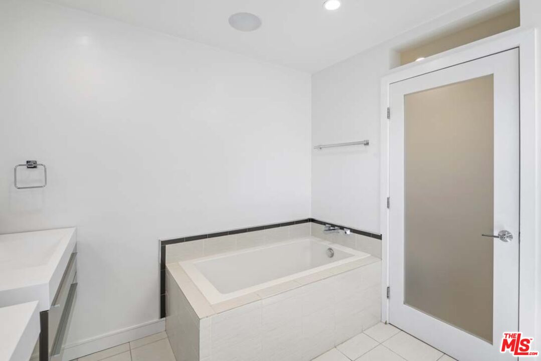 10453 Holman Avenue Los Angeles, CA 90024 - Photo 57 of 67 a white bath tub sitting next to a white sink
