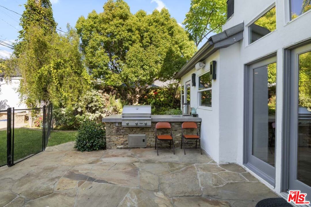 10453 Holman Avenue Los Angeles, CA 90024 - Photo 59 of 67 a view of backyard with outdoor seating and plants
