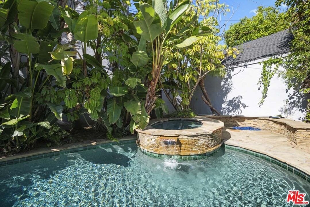10453 Holman Avenue Los Angeles, CA 90024 - Photo 64 of 67 a view of a backyard with plants and a fountain
