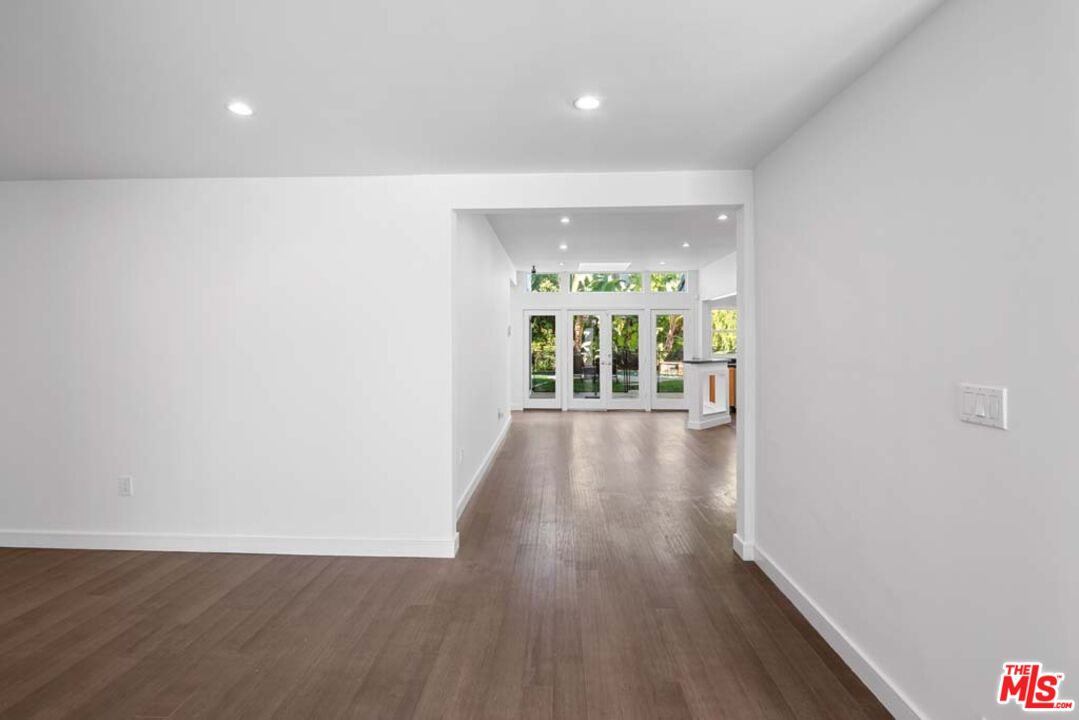 10453 Holman Avenue Los Angeles, CA 90024 - Photo 7 of 67 a view of an empty room with wooden floor and a window
