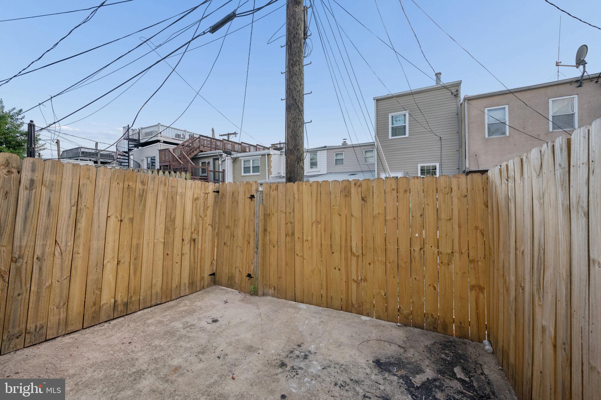 1108 South Clinton Street Baltimore, MD 21224 - Photo 56 of 66 Private outdoor retreat with rustic charm.