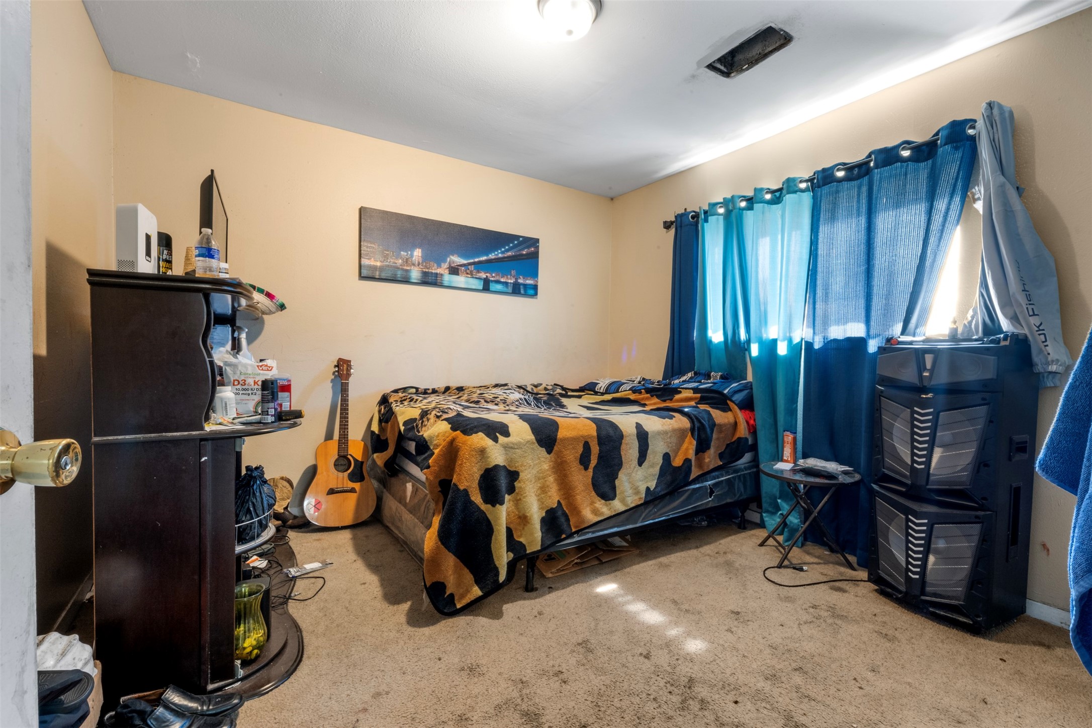 7726 Boggess Road Houston, TX 77016 - Photo 13 of 30 a bed room with a bed and a window