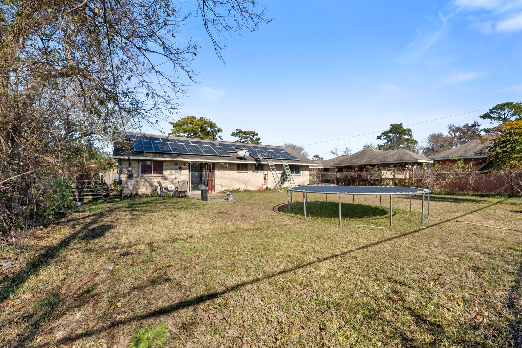 7726 Boggess Road Houston, TX 77016 - Photo 16 of 30 a view of a swimming pool with an outdoor seating