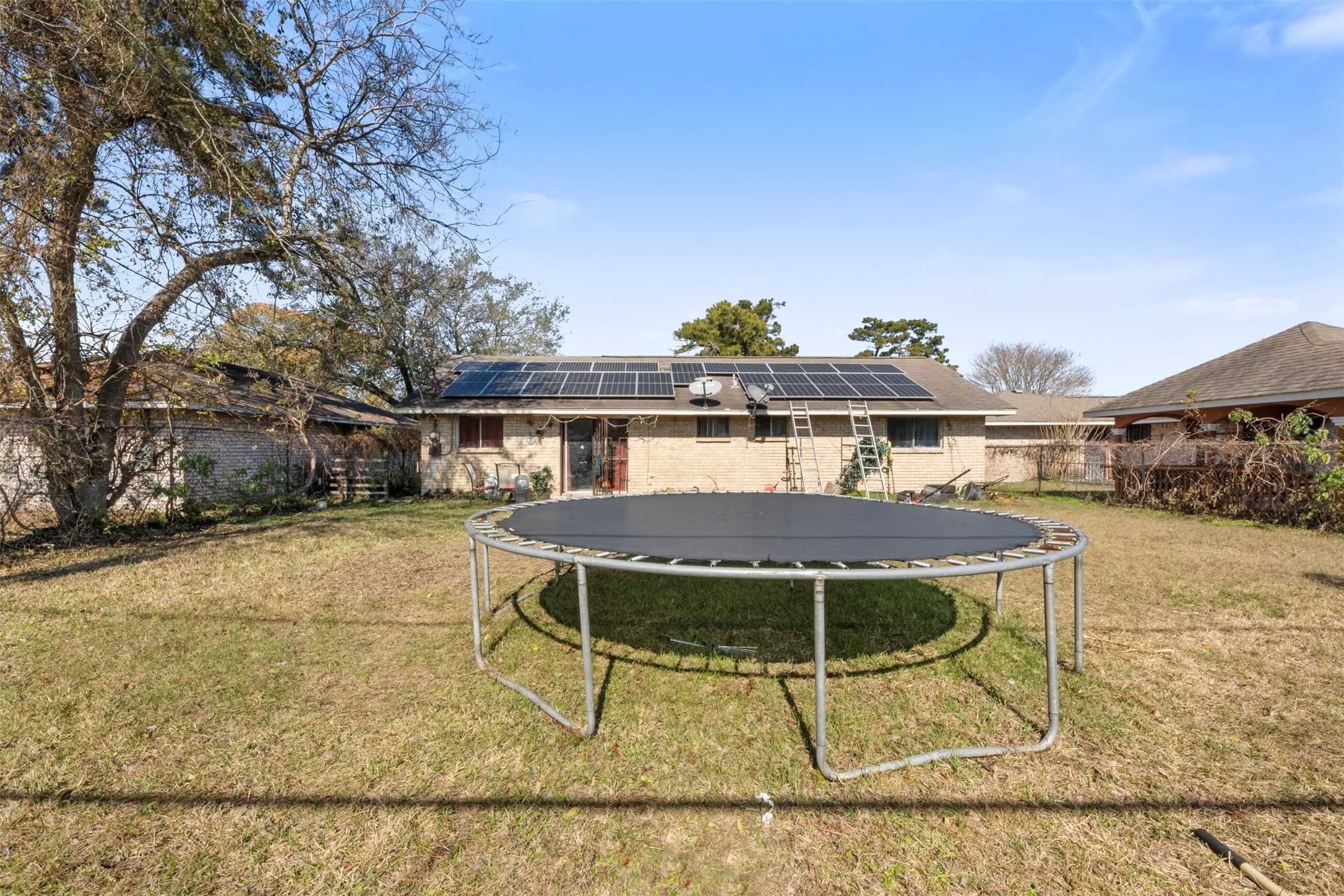 7726 Boggess Road Houston, TX 77016 - Photo 17 of 30 a view of a patio with table and chairs and potted plants