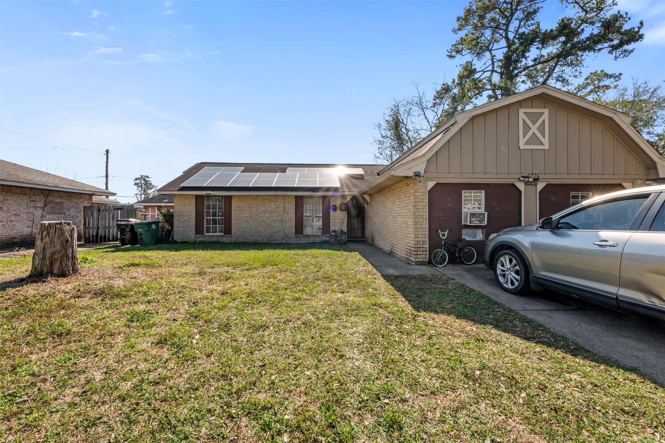 7726 Boggess Road Houston, TX 77016 - Photo 20 of 30 a view of a house with a yard