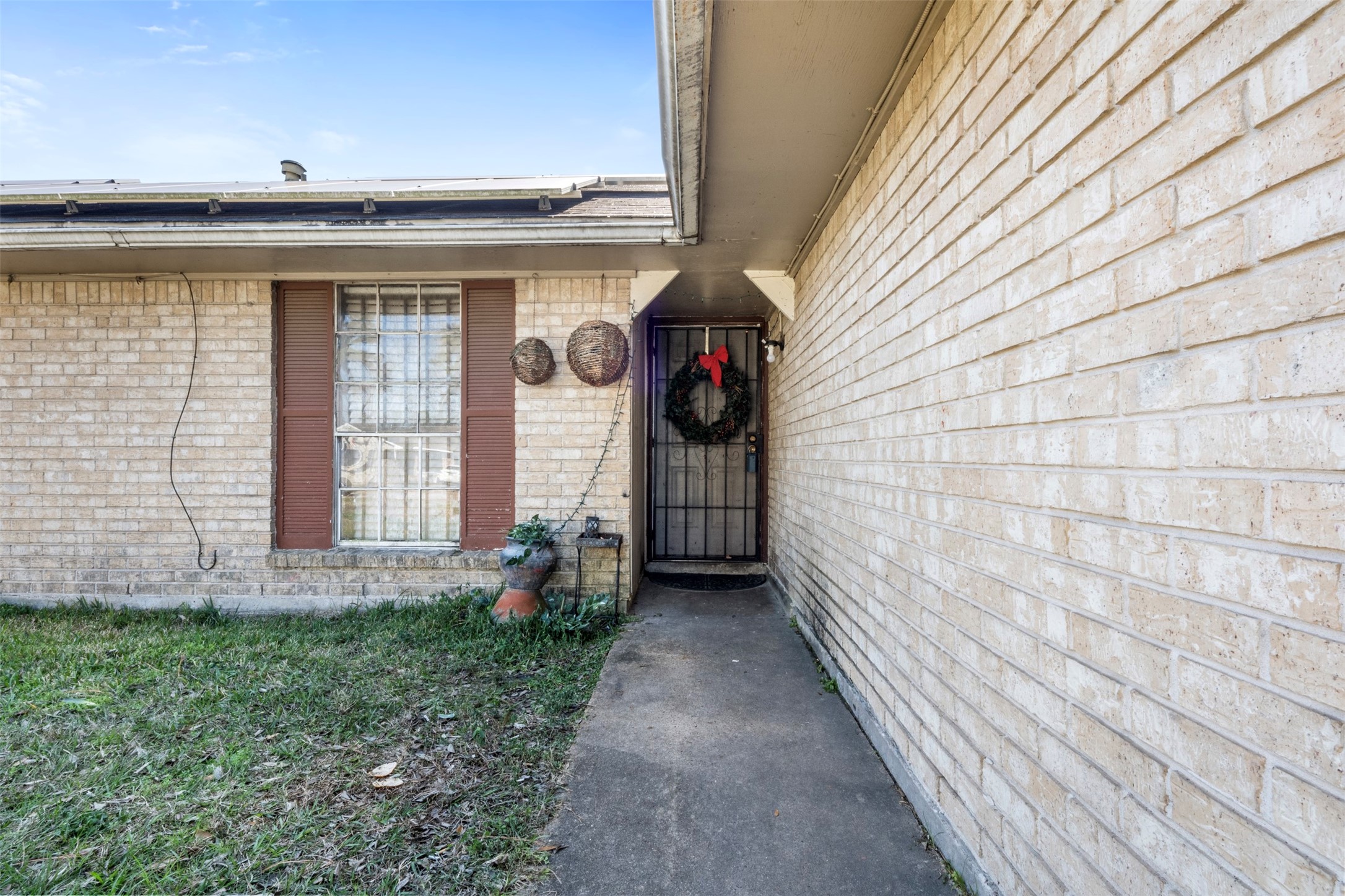 7726 Boggess Road Houston, TX 77016 - Photo 2 of 30 a view of a pathway of a house with backyard