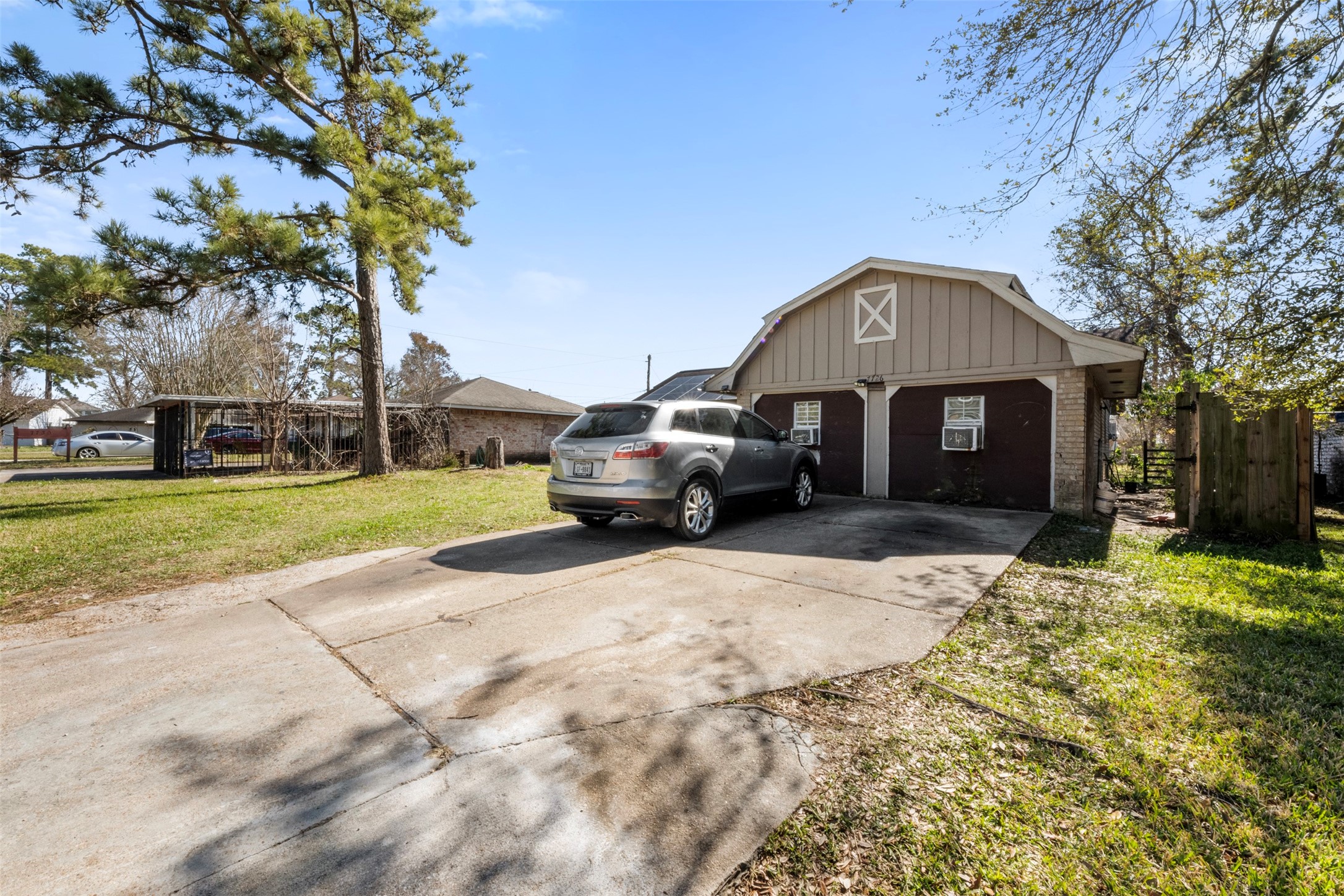 7726 Boggess Road Houston, TX 77016 - Photo 21 of 30 a view of a house with a yard