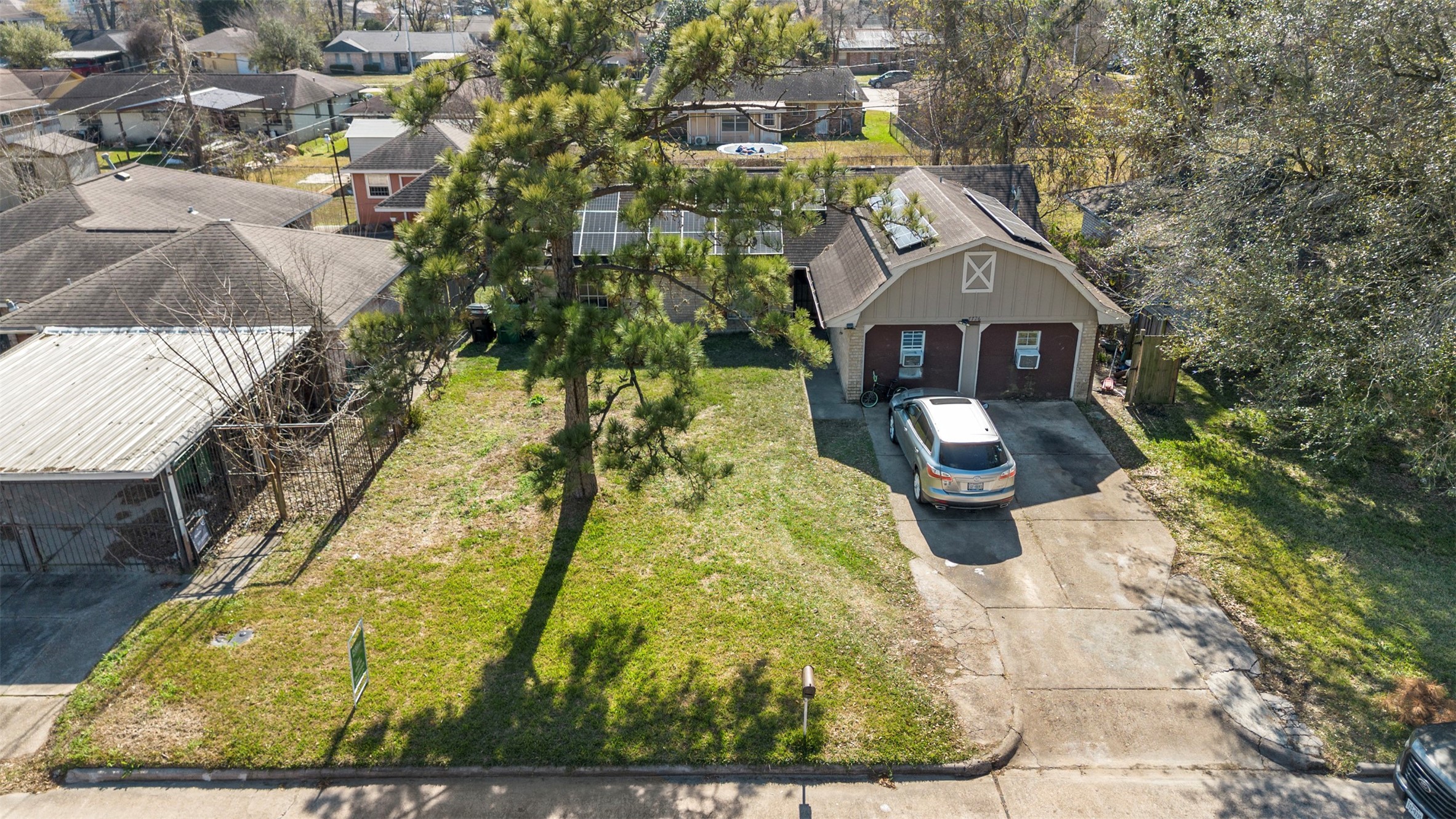 7726 Boggess Road Houston, TX 77016 - Photo 23 of 30 a aerial view of a house with a yard
