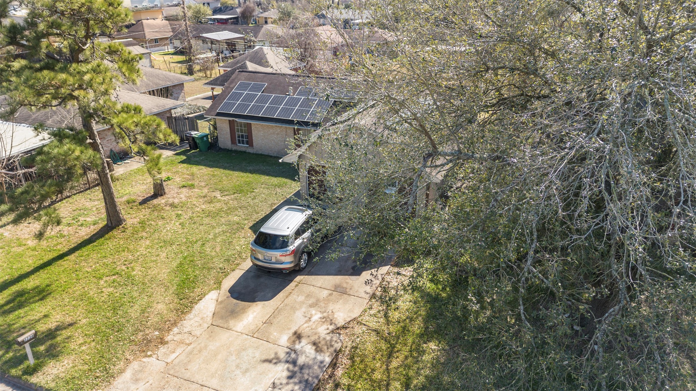 7726 Boggess Road Houston, TX 77016 - Photo 24 of 30 a view of a small yard in front of the house