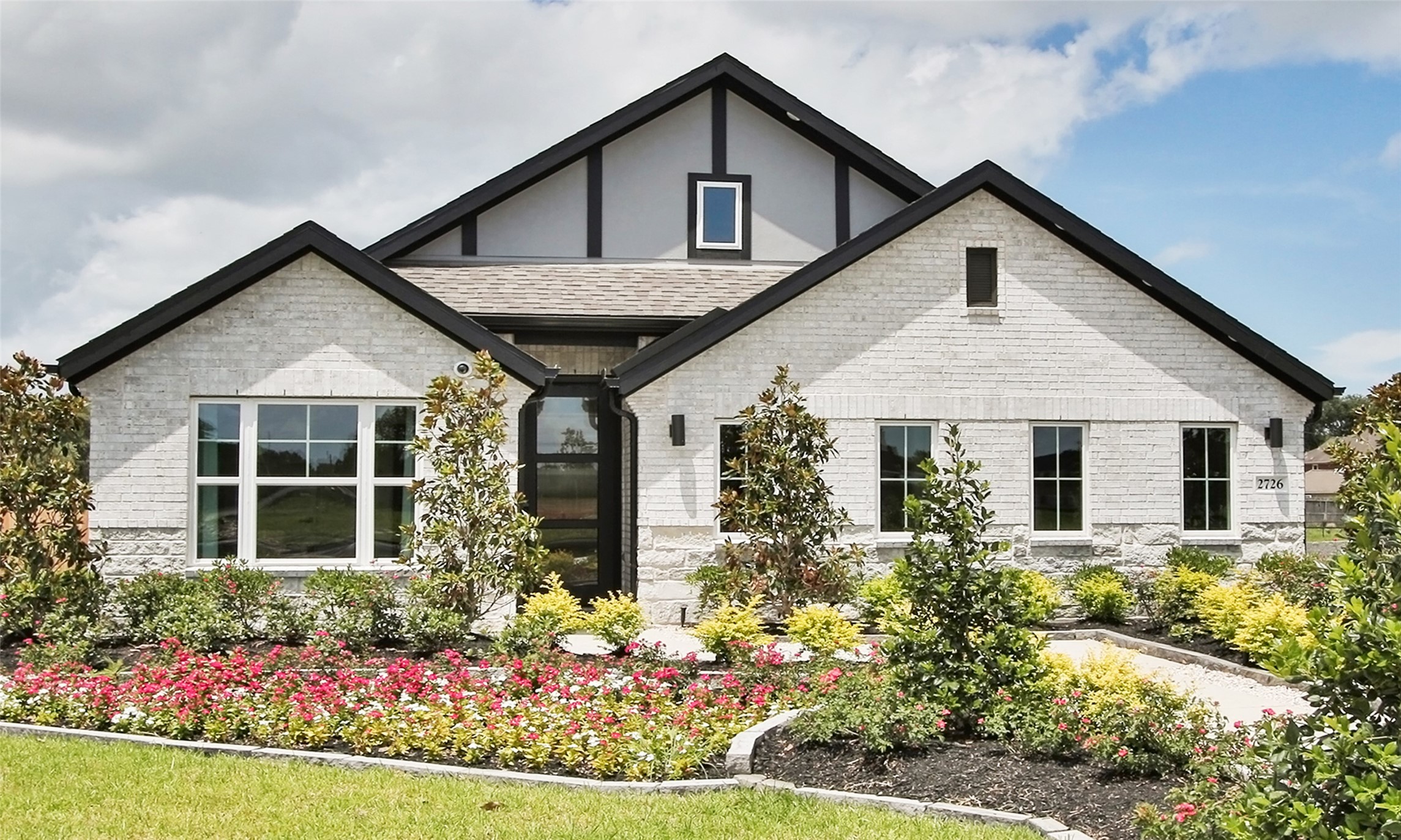 front view of a house with a yard