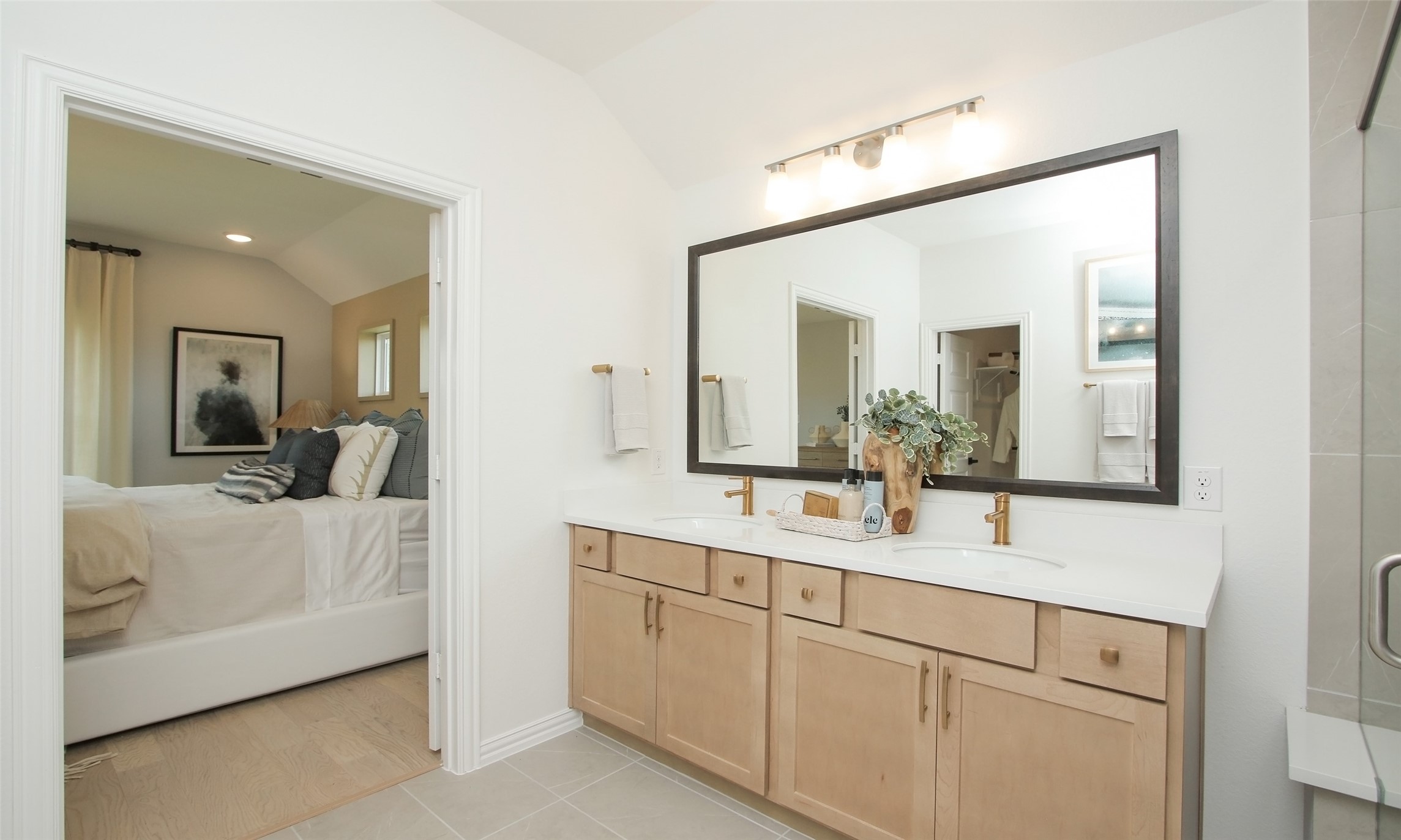 2726 Alexis Street Seabrook, TX 77586 - Photo 14 of 31 a en suite bathroom with a double vanity sink and mirror