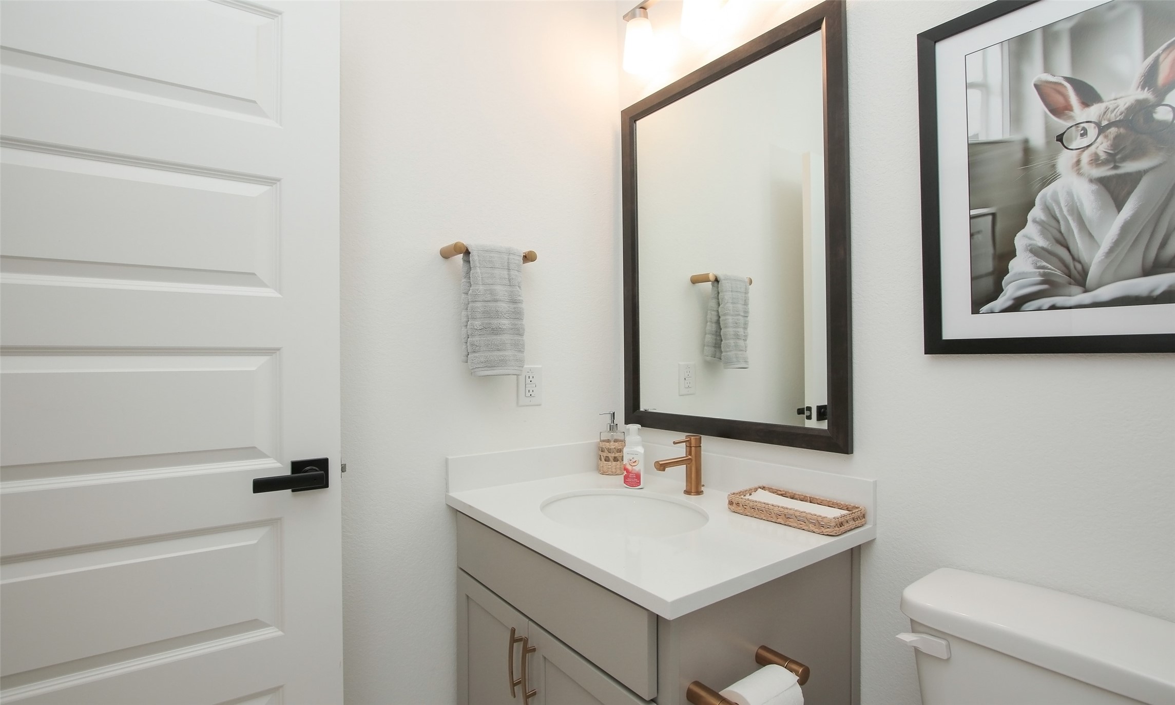 2726 Alexis Street Seabrook, TX 77586 - Photo 20 of 31 a bathroom with a sink a toilet and a mirror