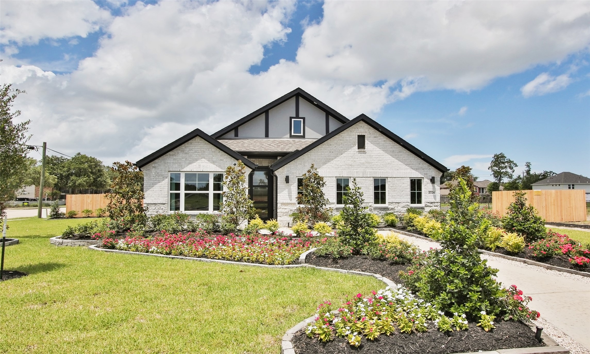 2726 Alexis Street Seabrook, TX 77586 - Photo 2 of 31 a front view of a house with garden