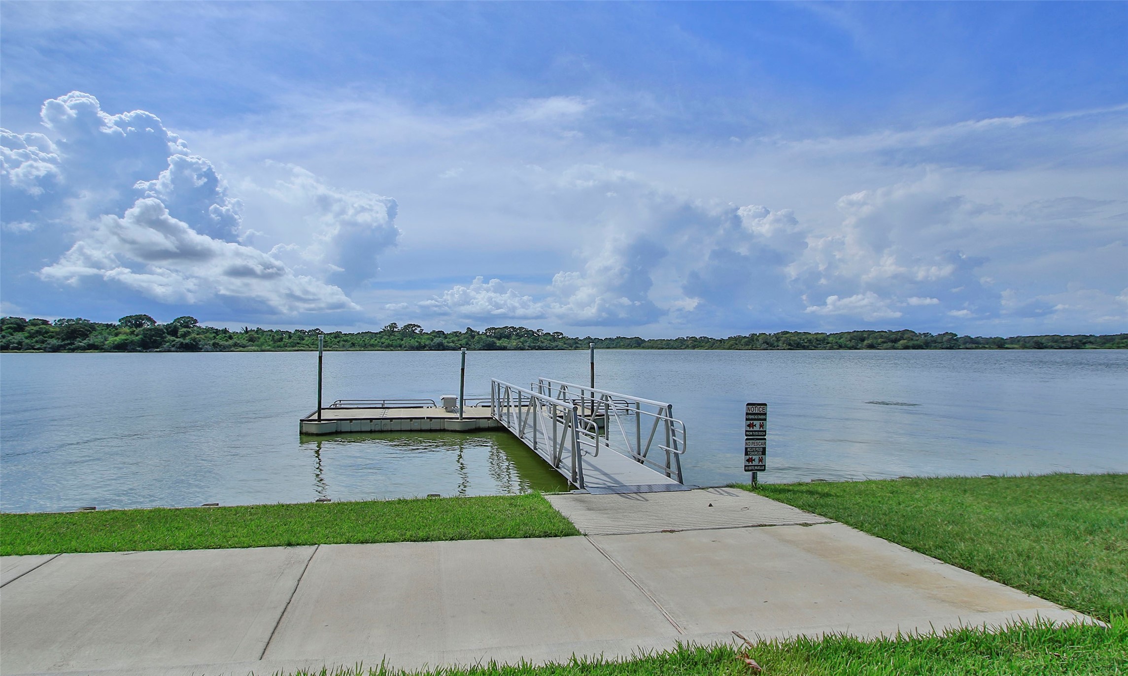 2726 Alexis Street Seabrook, TX 77586 - Photo 28 of 31 a view of a terrace with a garden and lake view
