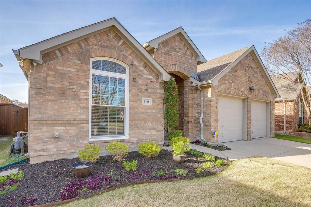 8105 Hosta Way Fort Worth, TX 76123 - Photo 2 of 33 a front view of a house with garden