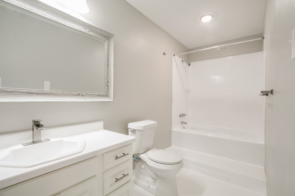 1343 Littleport Lane Channelview, TX 77530 - Photo 20 of 33 a bathroom with a sink a toilet and shower