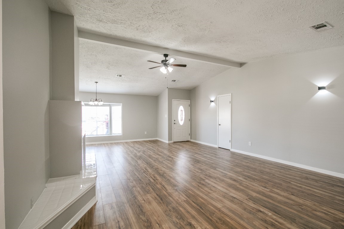 1343 Littleport Lane Channelview, TX 77530 - Photo 5 of 33 wooden floor in an empty room with a window