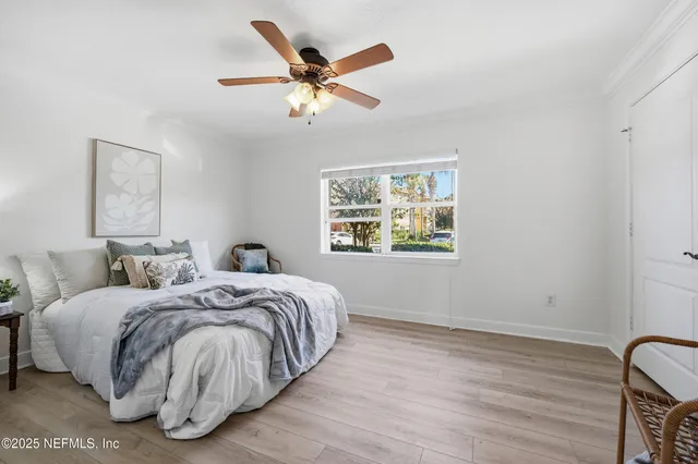 a bedroom with a bed and a lamp on table