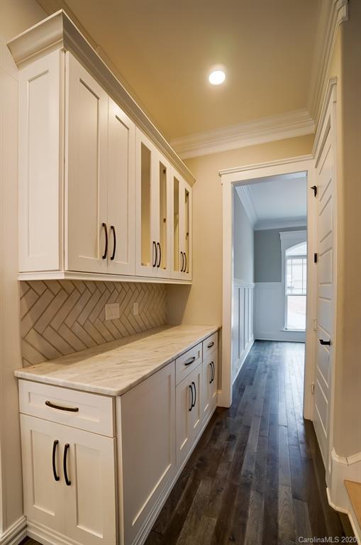 684 Portpatrick Place Fort Mill, SC 29708 - Photo 16 of 25 a view of a hallway with wooden floor and staircase