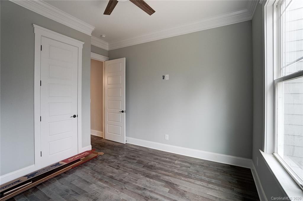 684 Portpatrick Place Fort Mill, SC 29708 - Photo 23 of 25 wooden floor in an empty room with a window
