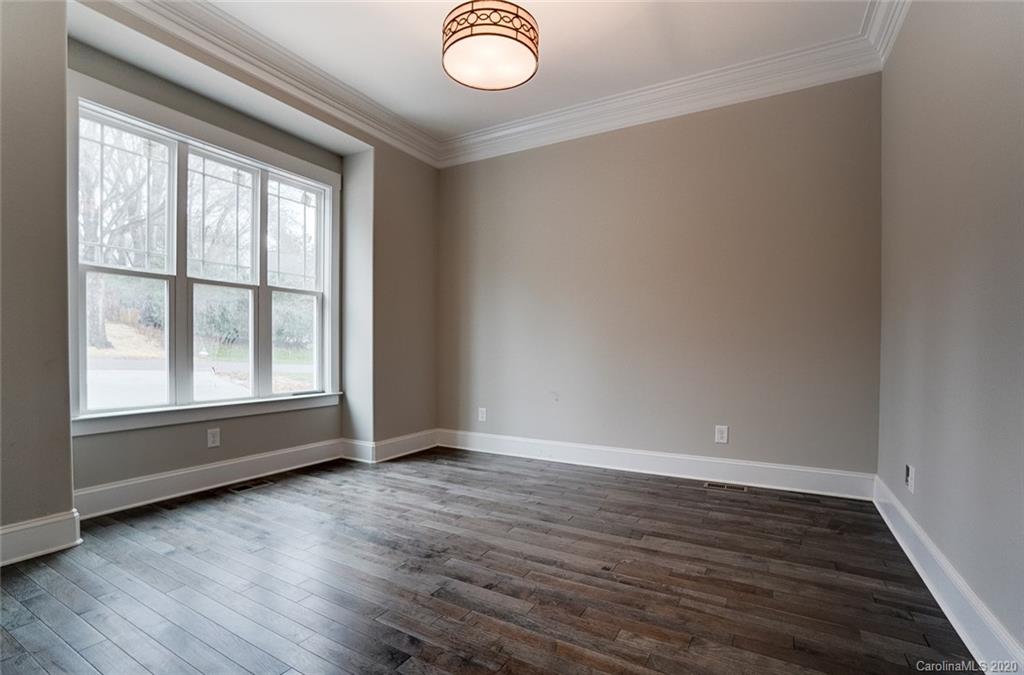 684 Portpatrick Place Fort Mill, SC 29708 - Photo 5 of 25 an empty room with wooden floor and windows