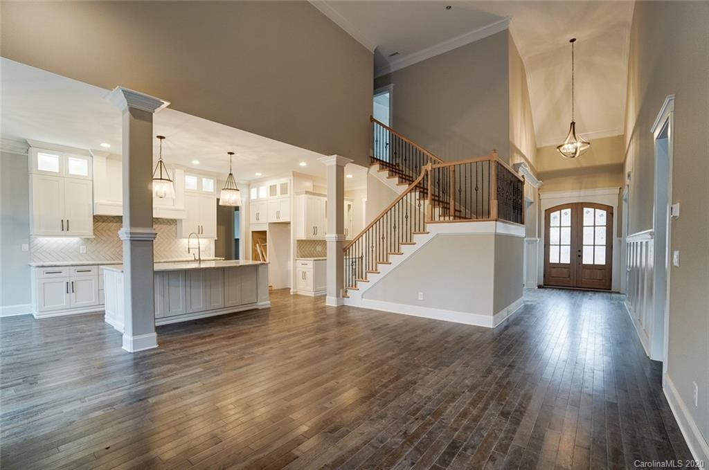 684 Portpatrick Place Fort Mill, SC 29708 - Photo 8 of 25 a view of a living room and kitchen with a large window