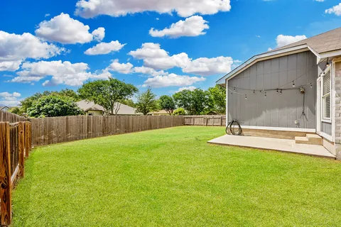 a view of a backyard with a garden