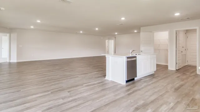 a view of a kitchen with wooden floor