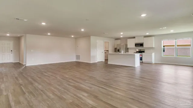 a view of a kitchen with a dishwasher and a refrigerator
