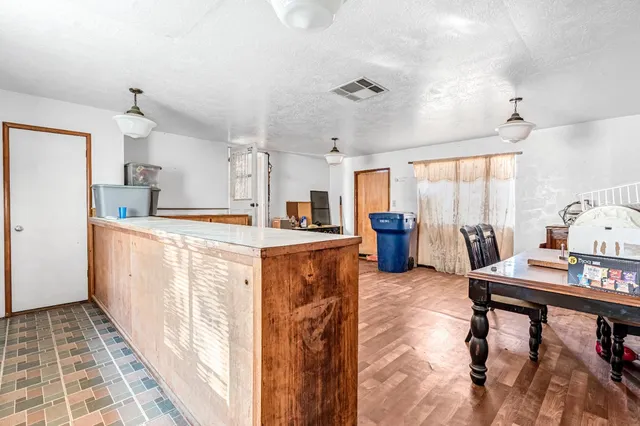 a kitchen with a stove and a refrigerator