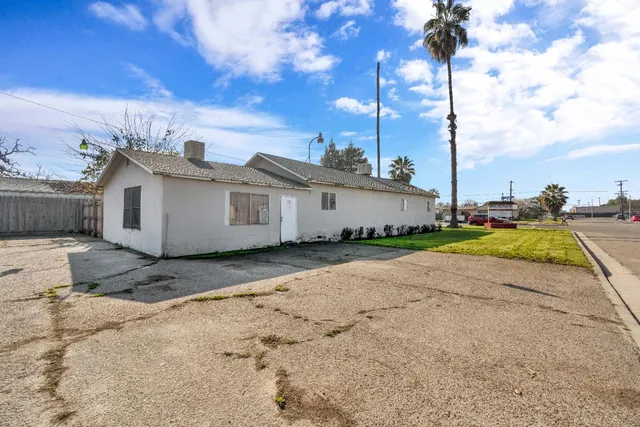 an aerial view of a house with a swimming pool