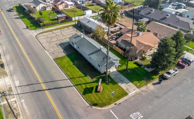 an aerial view of houses with yard