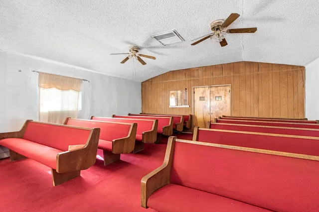 a projector room with furniture and a window