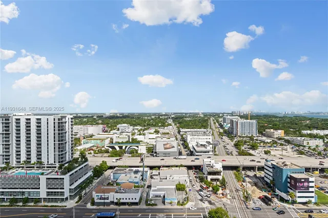 a view of a swimming pool with a patio and a patio