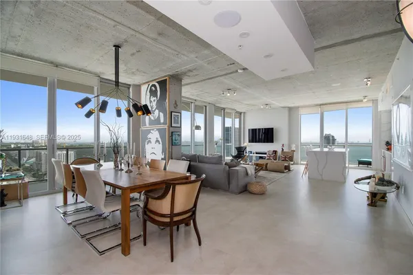 a view of a dining room with furniture window and outside view