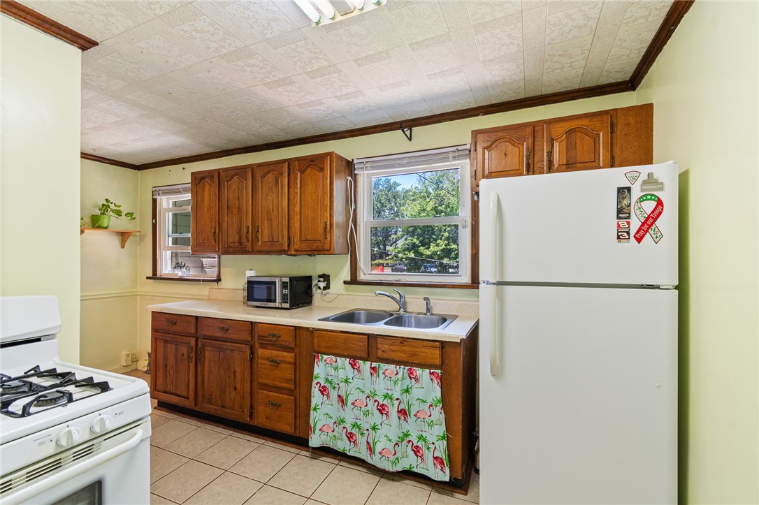 206 English Road Greece, NY 14616 - Photo 10 of 24 This “easy to work” in kitchen has a wonderful vi