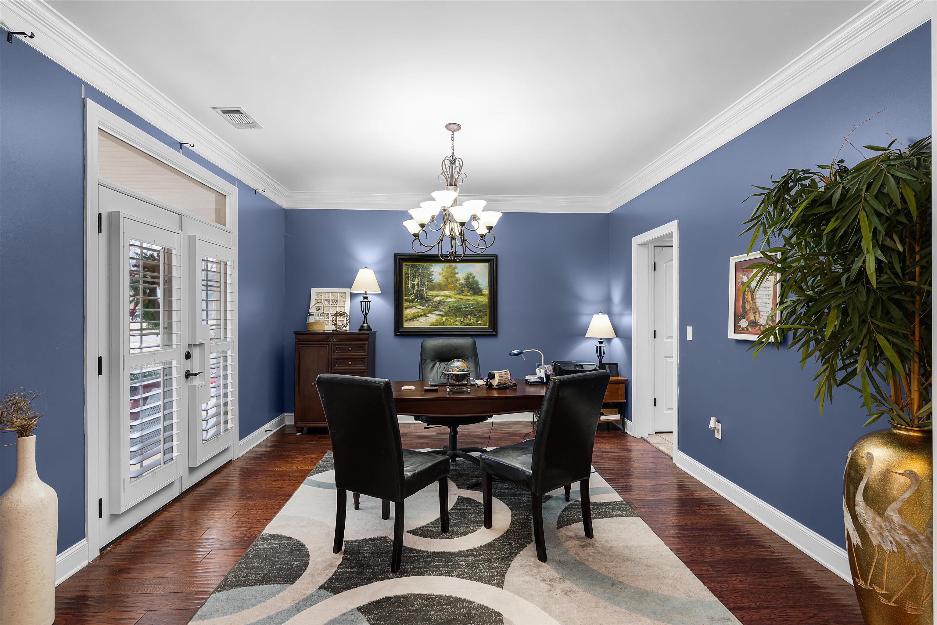 3285 Shadowood Lane Corinth, MS 38834 - Photo 16 of 31 a dining room with furniture window and wooden floor