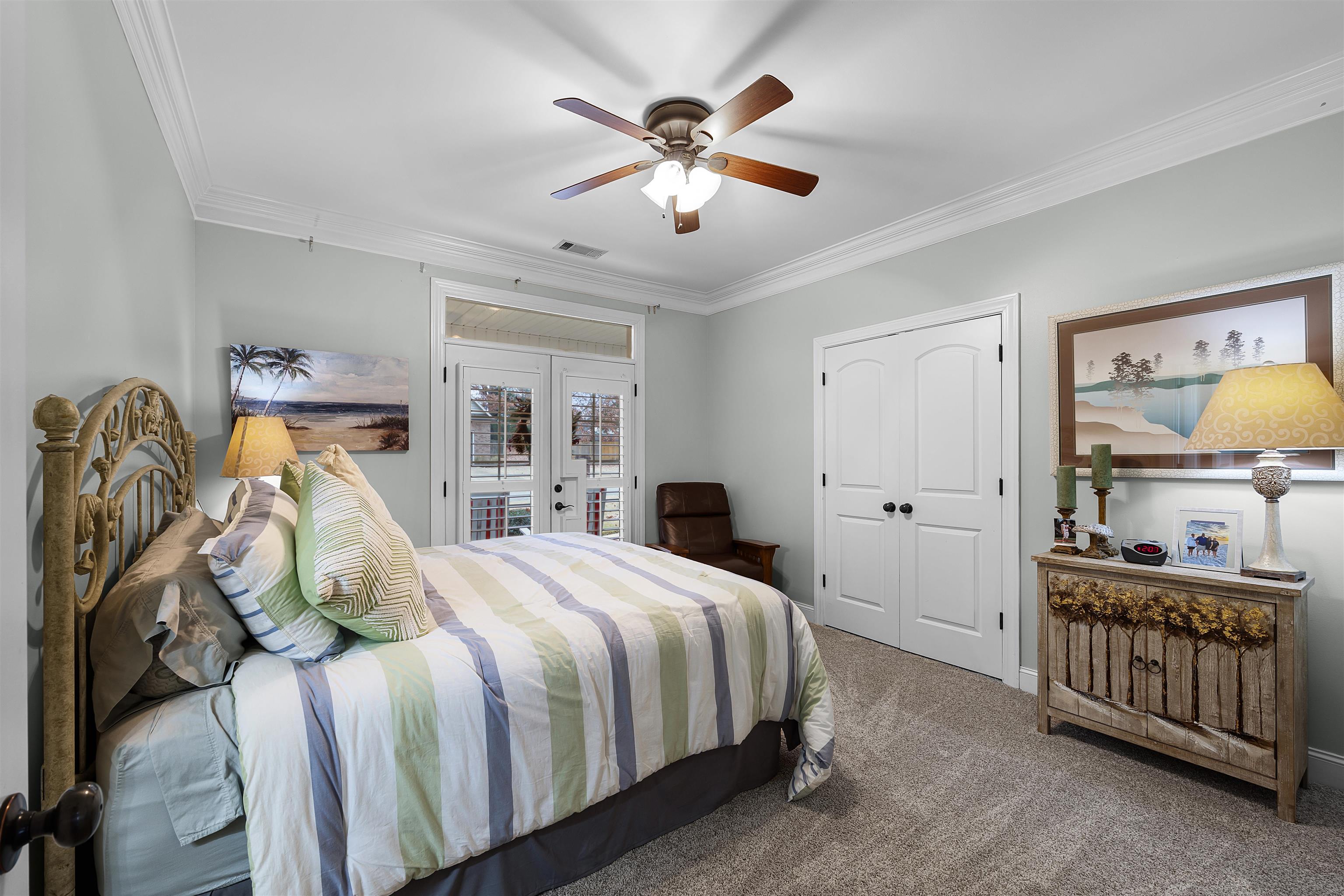3285 Shadowood Lane Corinth, MS 38834 - Photo 26 of 31 a bedroom with a bed and ceiling fan