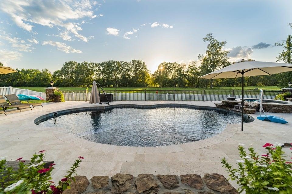 3285 Shadowood Lane Corinth, MS 38834 - Photo 27 of 31 a view of a swimming pool with a patio and a garden