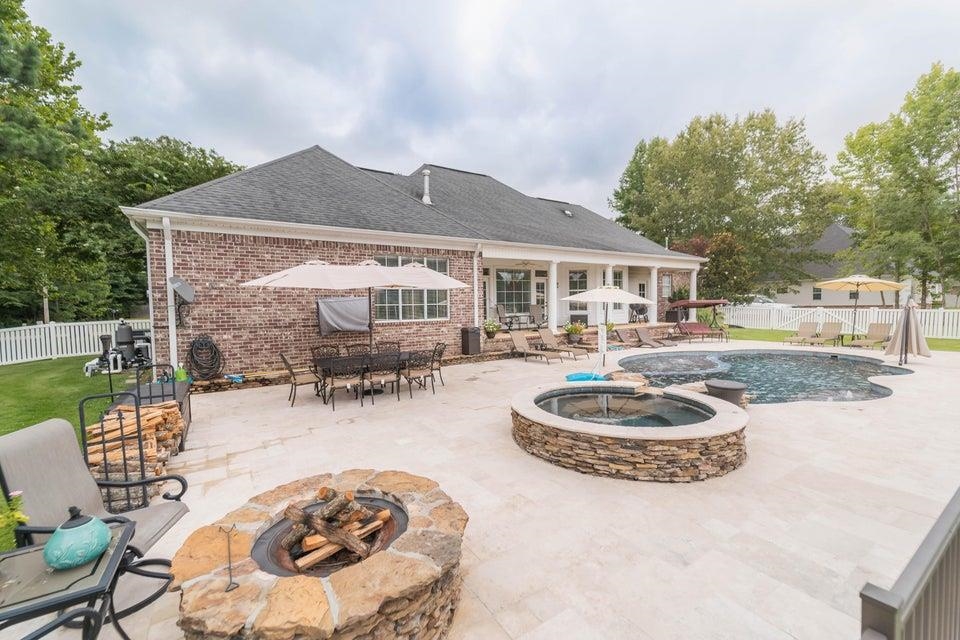 3285 Shadowood Lane Corinth, MS 38834 - Photo 29 of 31 a swimming pool with barbeque oven fire pit table and chairs