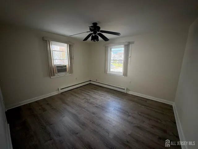a view of a storage and utility room with washer and dryer