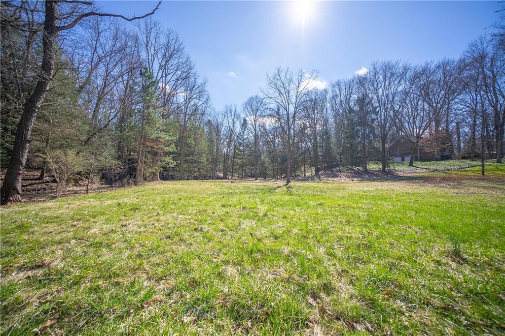 110 Bradford Park Road Baden, PA 15005 - Photo 2 of 14 a view of outdoor space with swimming pool and trees
