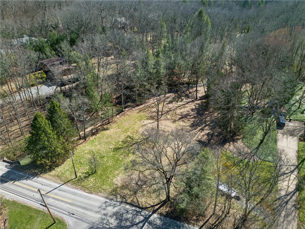 110 Bradford Park Road Baden, PA 15005 - Photo 5 of 14 a view of a yard with plants and large trees