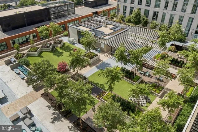 an aerial view of multiple houses with yard