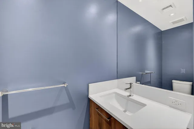 a bathroom with a sink and a vanity