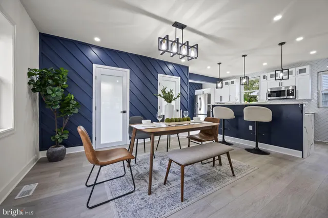 a kitchen with sink stove and cabinets