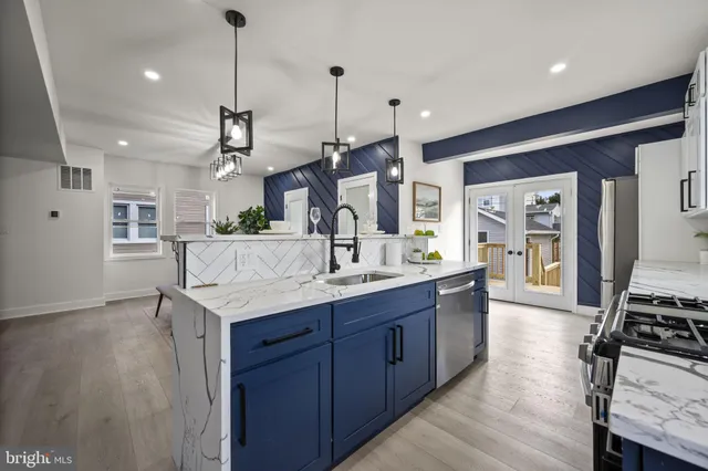 a view of an empty room with closet and a window